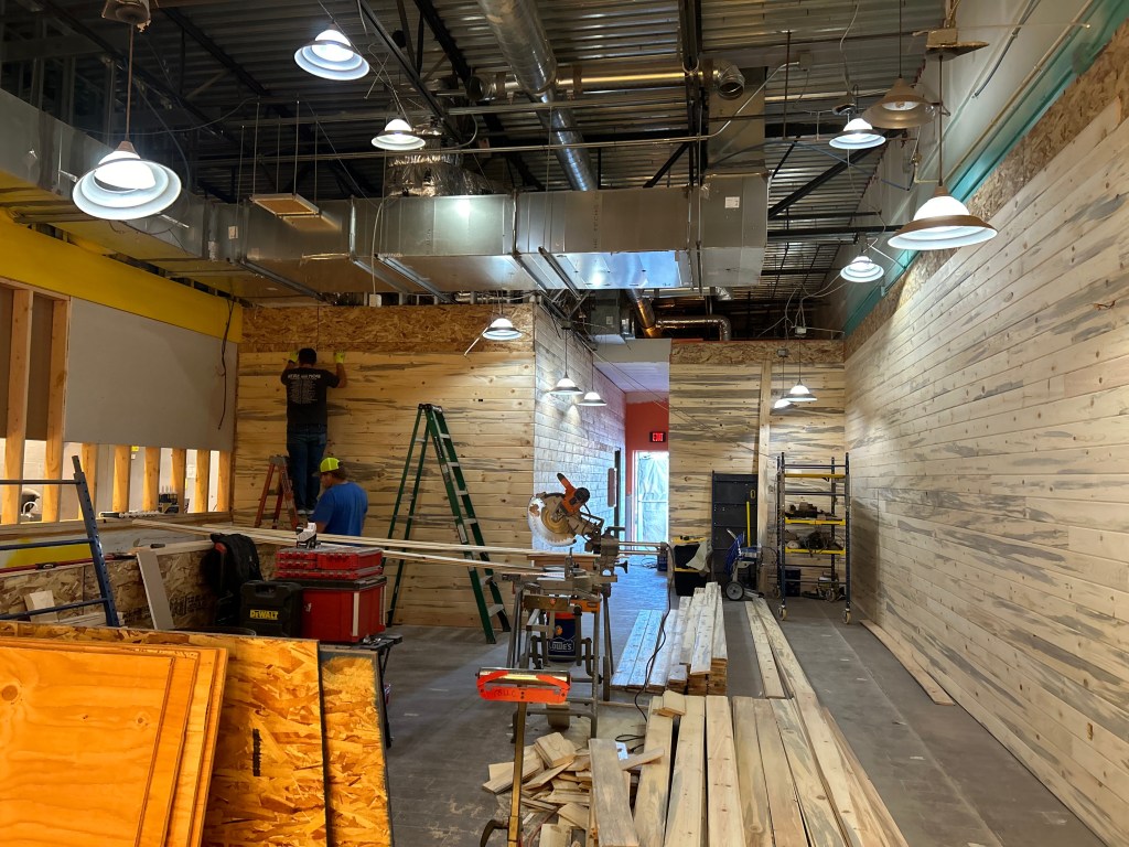 Project manager coordinating trades and schedules on Spokane jobsite